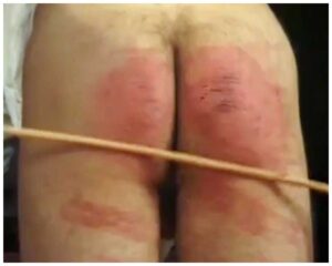 Mistress administers a hard punishment caning